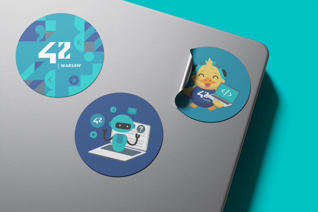 42 Warsaw stickers on a laptop lid
