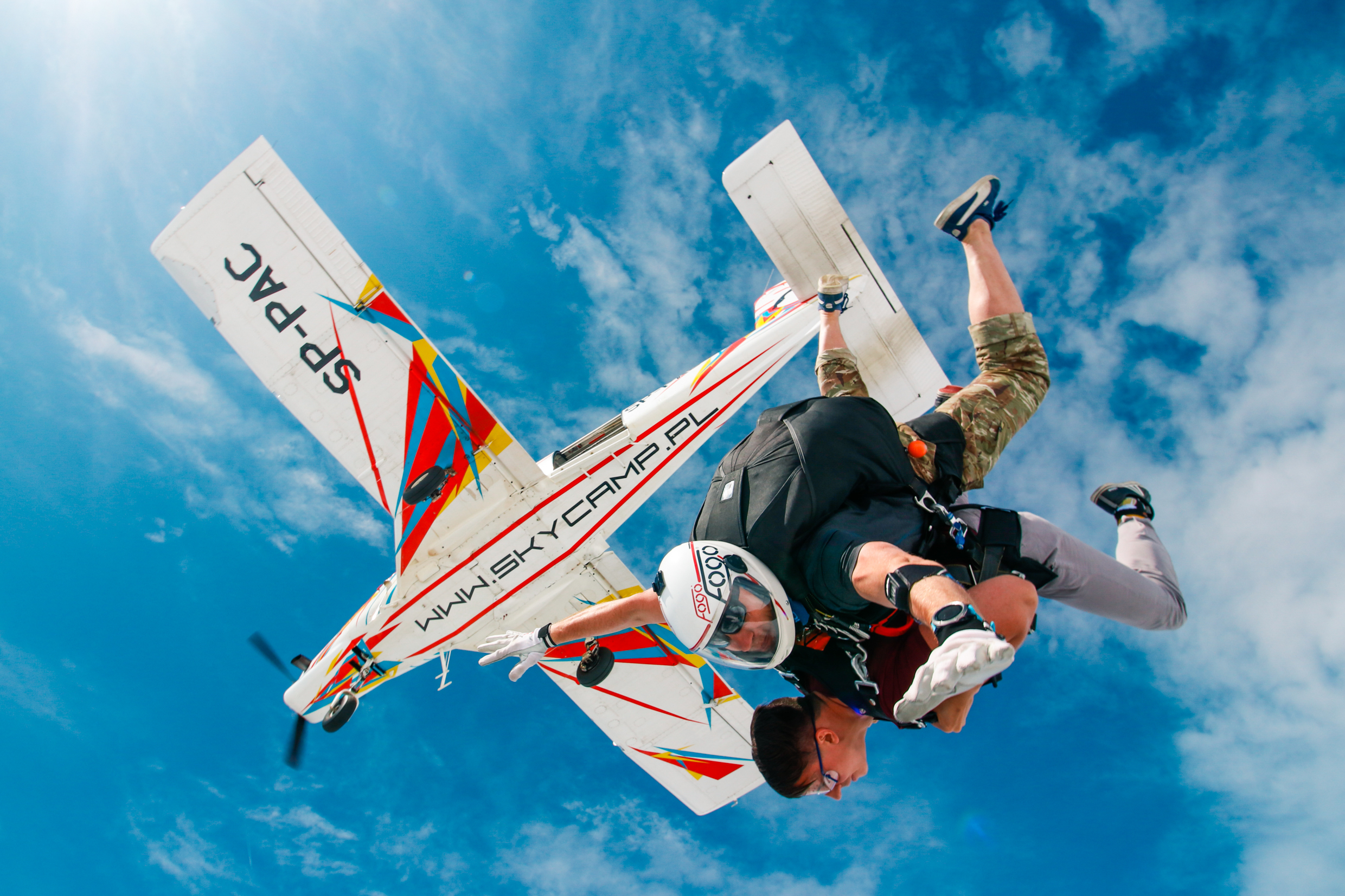 Tandem skydivers jumping from the plane