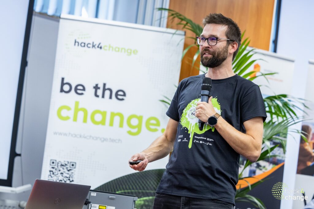 Speaker presenting at the hack4change hackathon