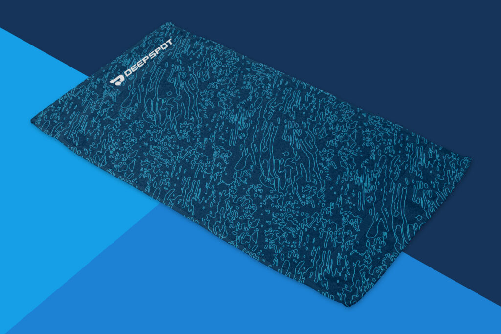 Deepspot towel with a blue water pattern