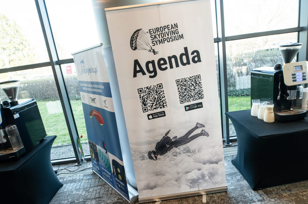 European Skydiving Symposium agenda roll-up banner with QR codes