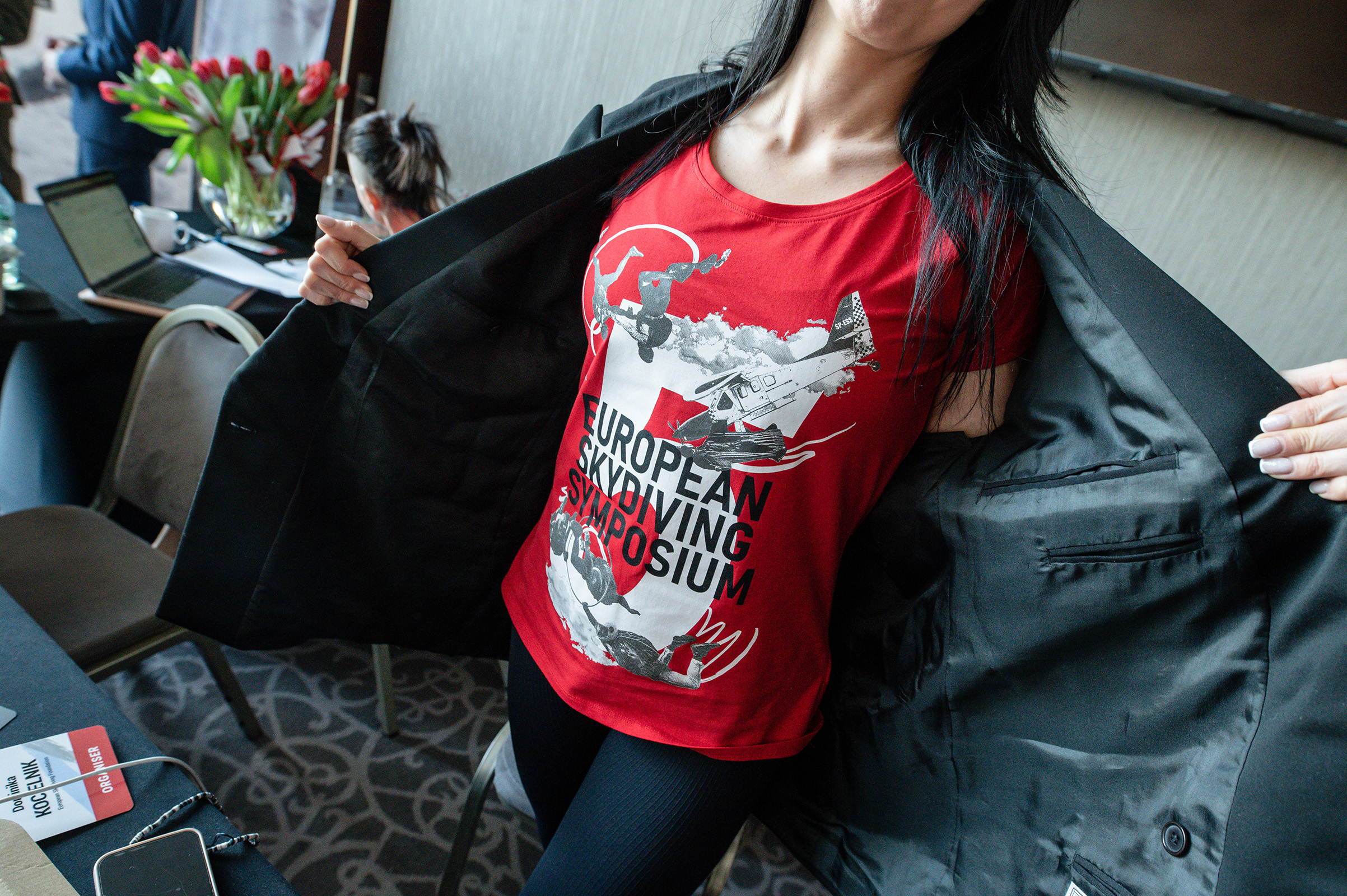 Woman in a red European Skydiving Symposium T-shirt