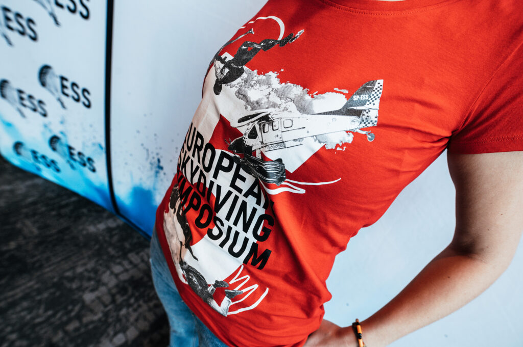 Close-up of the red European Skydiving Symposium T-shirt print