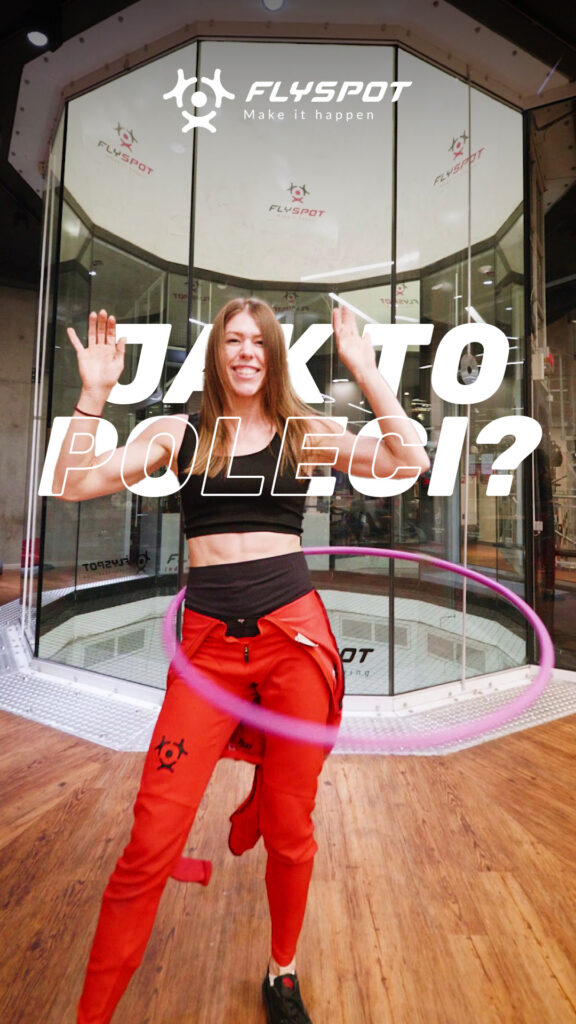 "Jak to poleci?" video cover: a woman with a hula hoop in front of the Flyspot wind tunnel