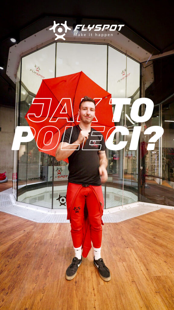 "Jak to poleci?" video cover: a man with a red umbrella in front of the Flyspot wind tunnel