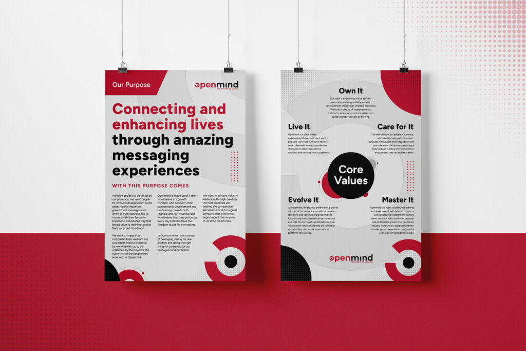 Two hanging Openmind Networks posters about the company's purpose and core values