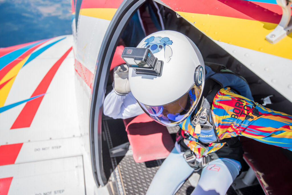 Skydiver with a helmet camera in the plane door