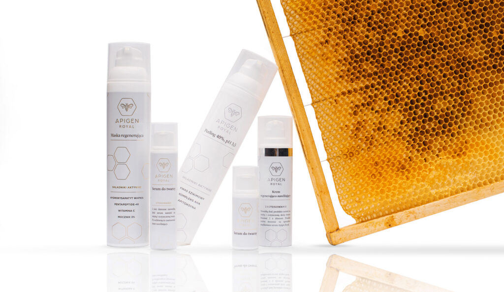 Apigen Royal cosmetics line-up next to a honeycomb frame