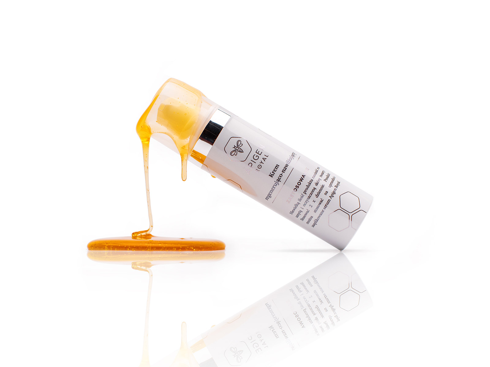 Apigen Royal cream tube in a pool of honey