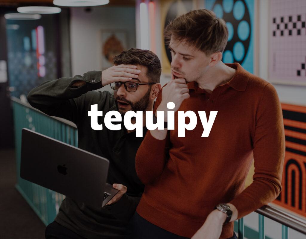 Two colleagues looking at a laptop, with the Tequipy logo