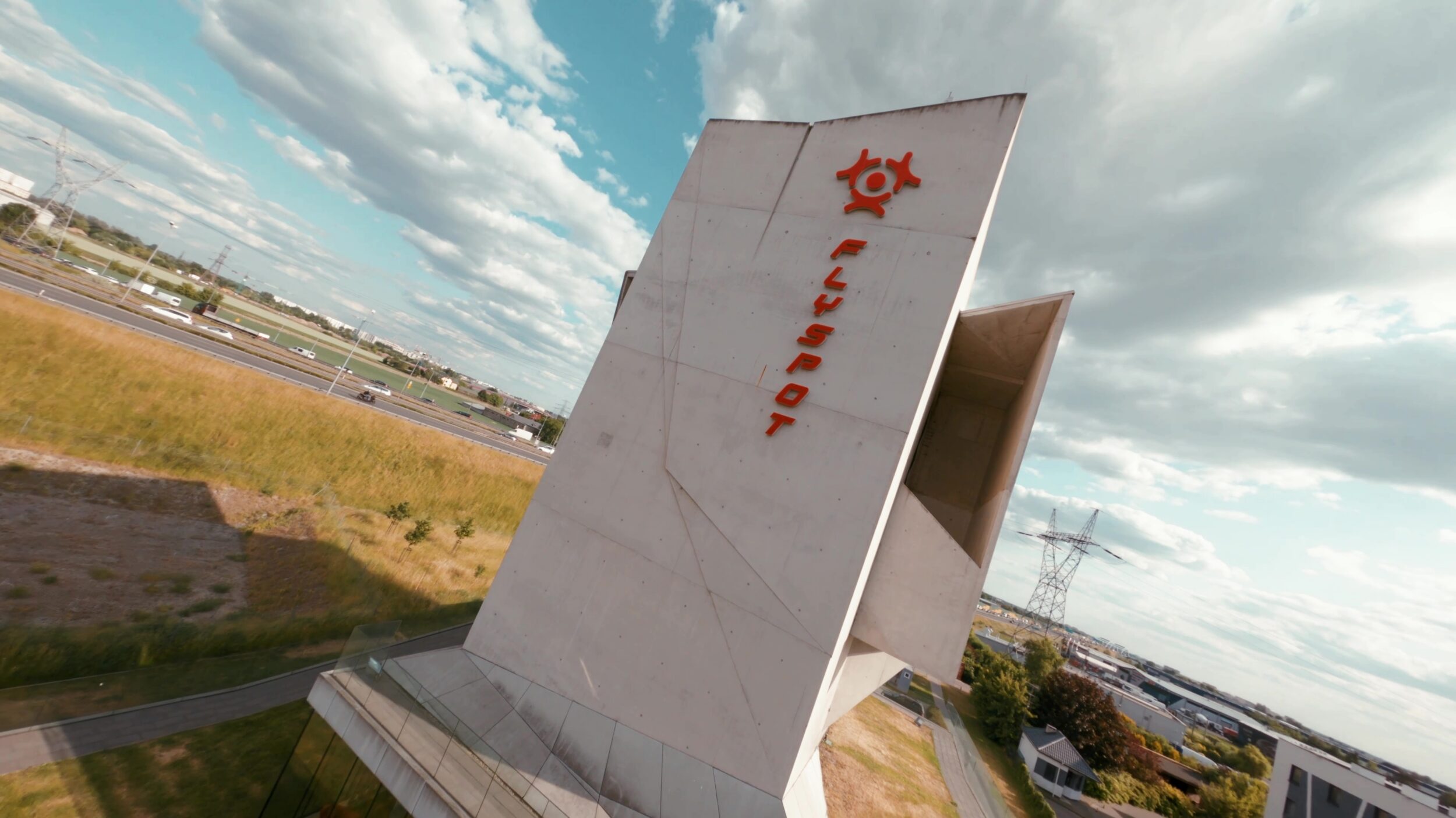 Flyspot wind tunnel tower seen from below against the sky