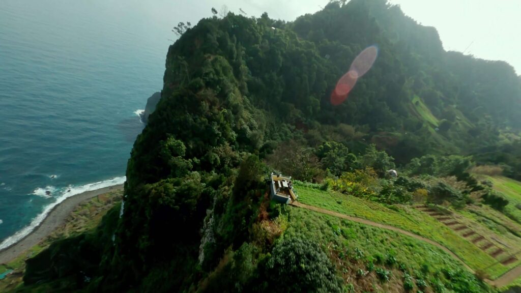 Parachute canopy beside a green sea cliff, Madeira