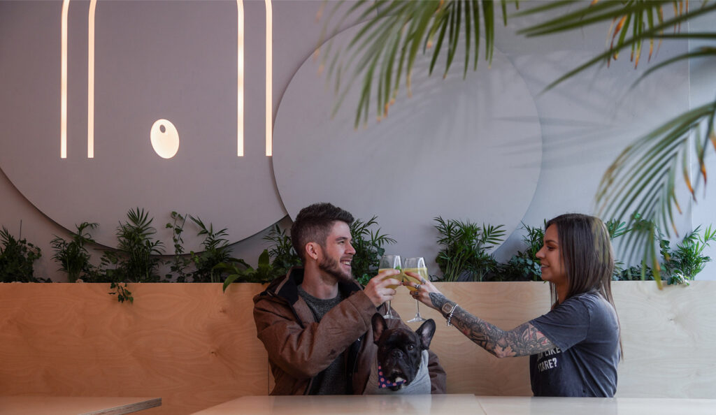 Couple toasting in the Ukryta Olivka pizzeria
