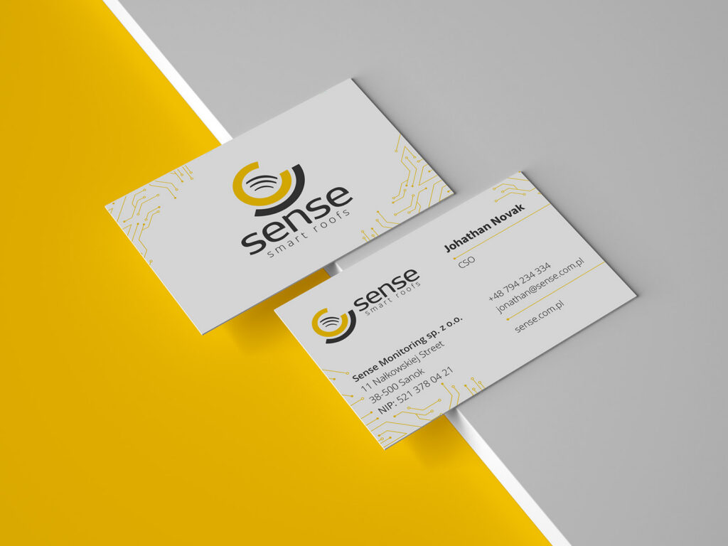 Sense Smart Roofs business cards on a yellow and grey background