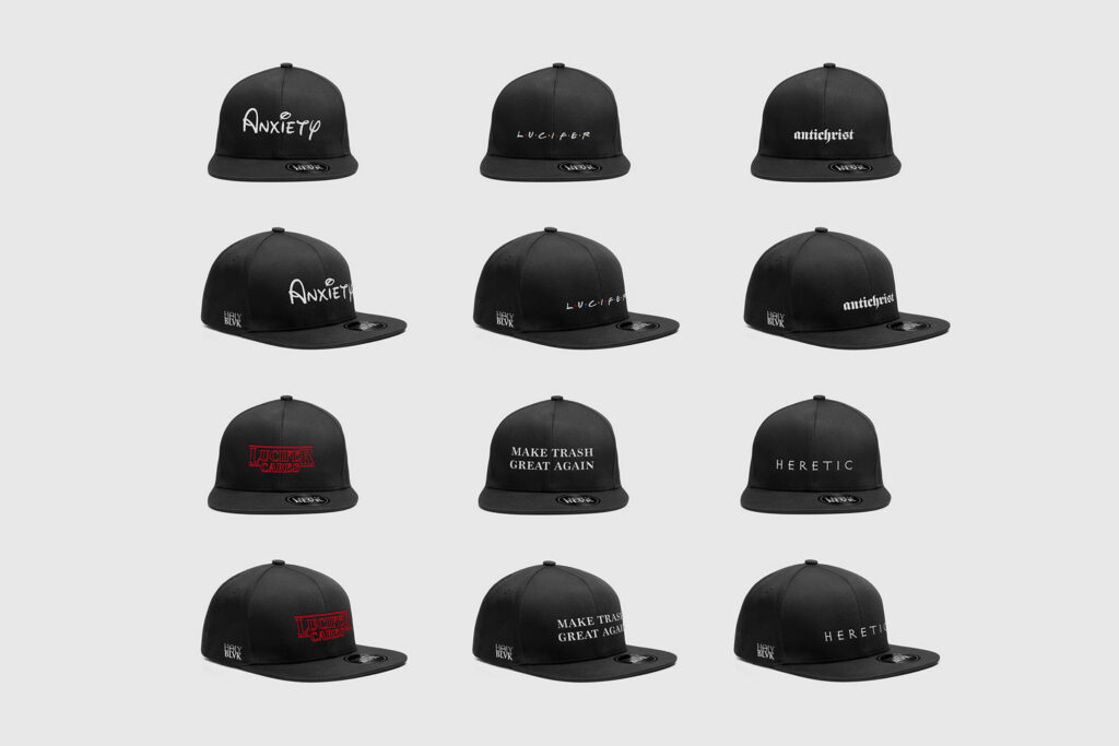 Twelve black caps with different Holy Blvk prints