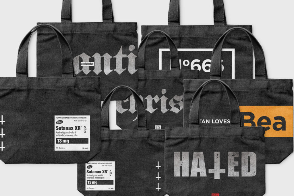 Black Holy Blvk tote bags with bold text prints