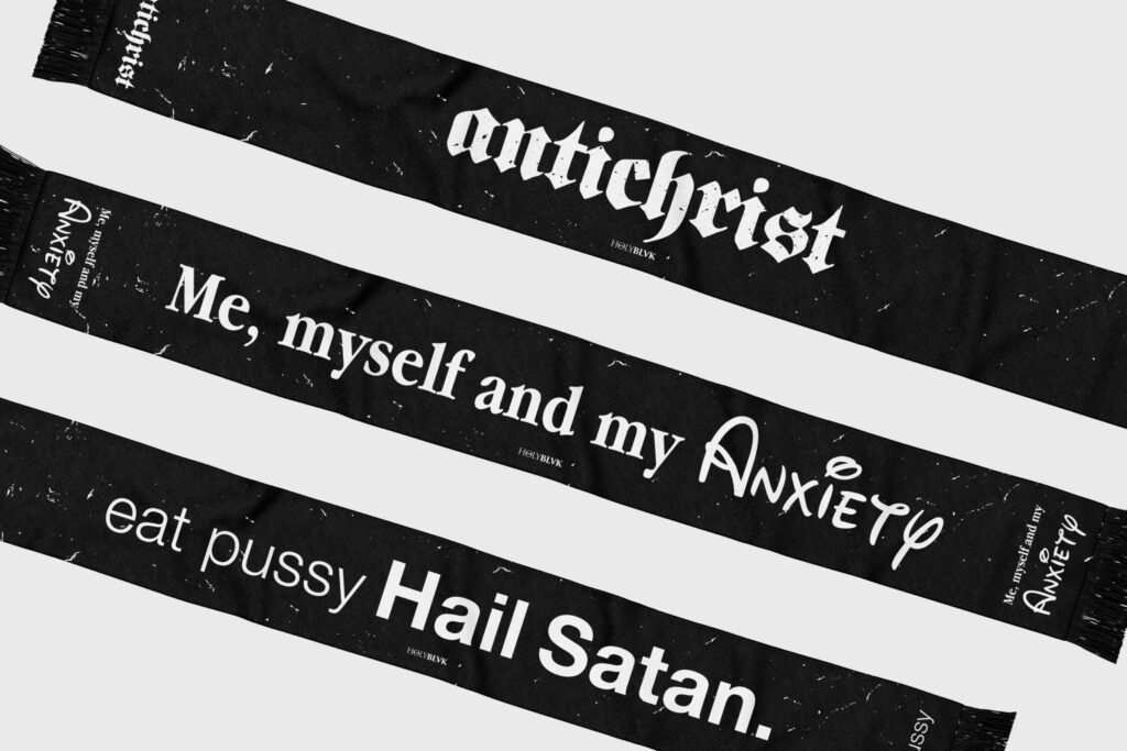 Black Holy Blvk straps printed with gothic and script lettering