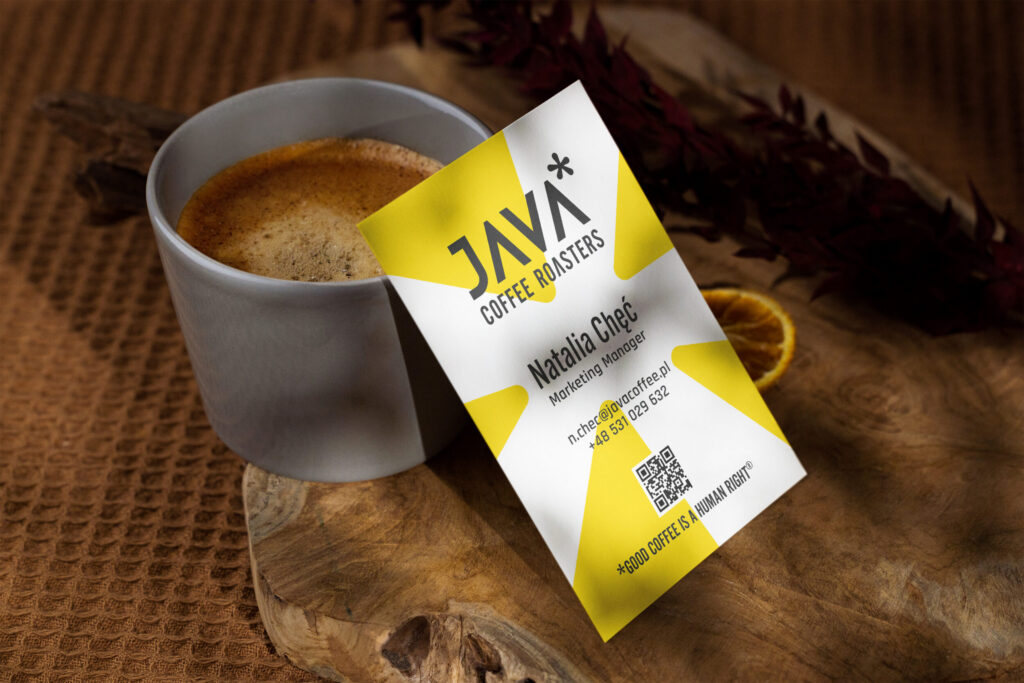 JAVA Coffee Roasters business card next to a cup of coffee
