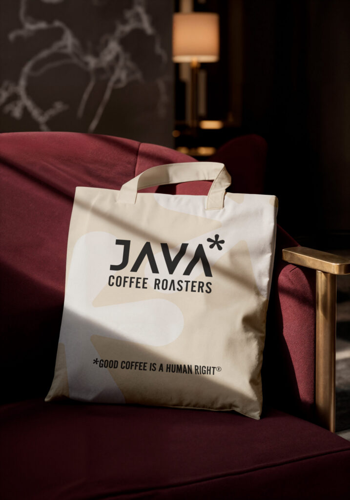 JAVA Coffee Roasters canvas tote bag on a chair