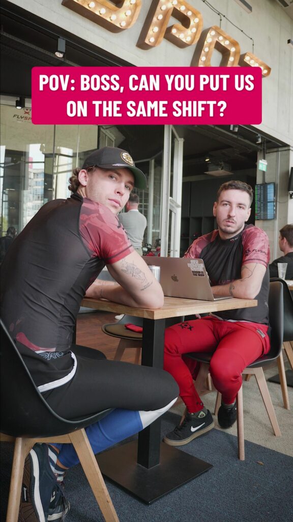 Flyspot reel still: two instructors at a table, captioned "POV: Boss, can you put us on the same shift?"